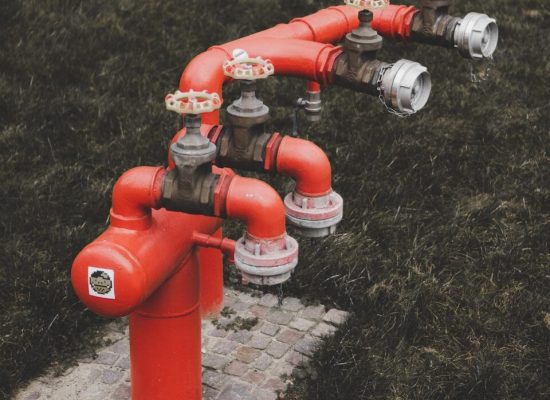 red fire hydrant with bottles